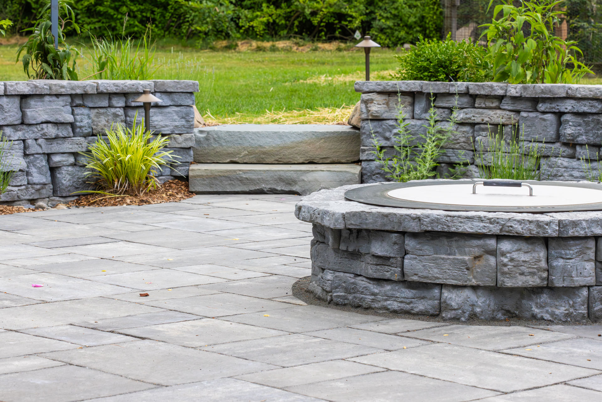 Curved bluestone patio and seat walls